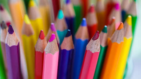 Color pencils, pastel abstract background. Artist sketching stationary creativity for students in school. Macro object set of drawing colorful. Art set, patterns of yellow, green, red, orange in groupの写真素材