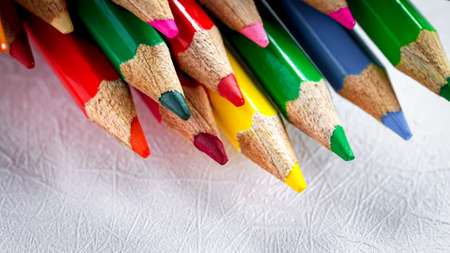 Color pencils, pastel abstract background. Artist sketching stationary creativity for students in school. Macro object set of drawing colorful. Art set, patterns of yellow, green, red, orange in groupの写真素材