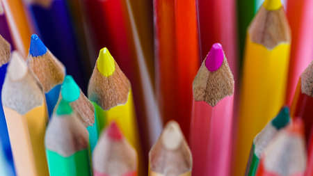 Color pencils, pastel abstract background. Artist sketching stationary creativity for students in school. Macro object set of drawing colorful. Art set, patterns of yellow, green, red, orange in groupの写真素材