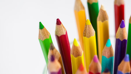 Color pencils, pastel abstract background. Artist sketching stationary creativity for students in school. Macro object set of drawing colorful. Art set, patterns of yellow, green, red, orange in groupの写真素材