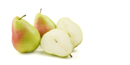 Green william pears cut-off on isolated white background. Fruity natural vitamin fruit cut in two. Freshness, healthy raw pears organic, sweet.の写真素材