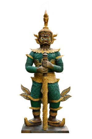 Ancient giant guardian statue in Thai temple palace Bangkok isolated on white background, spiritual art and architecture landmark destination religious history. Historic ramayana attraction worship.の写真素材