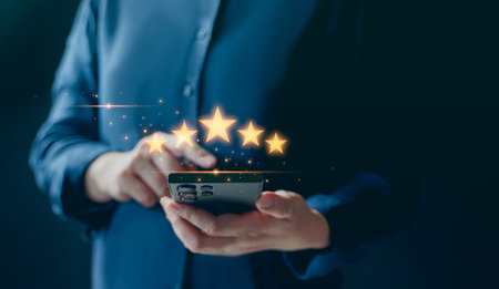 customer services best excellent business rating experience. Satisfaction survey concept. Hand of a businessman chooses a smile face on mobile feedback. 5 Star Satisfaction.の写真素材