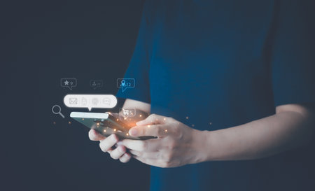 Concept of online messaging chat on cyberspace, business network. Women hand using smartphone typing, chatting conversation or comment. Social media maketing business communication technology.の写真素材
