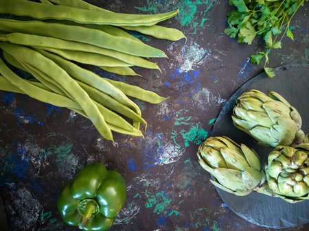 Orchard vegetables in composition on dark and rough backgroundの写真素材