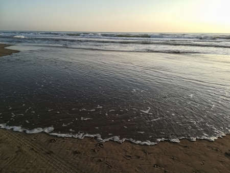 Beach of fine brown sand bathed by the waters of the Mediterranean Sea