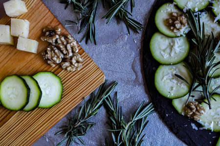 Carpaccio of zucchini with nuts and cheese on gray backgroundの写真素材