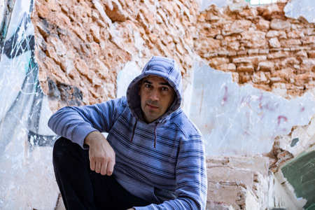 Man posing in abandoned house