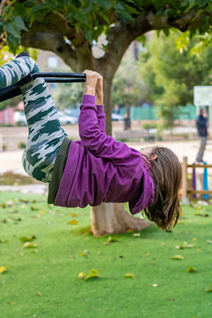Little girl playing in the village parkの写真素材