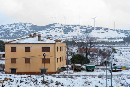 View of the snowy mountains with the electric mills in Barracasのeditorial素材