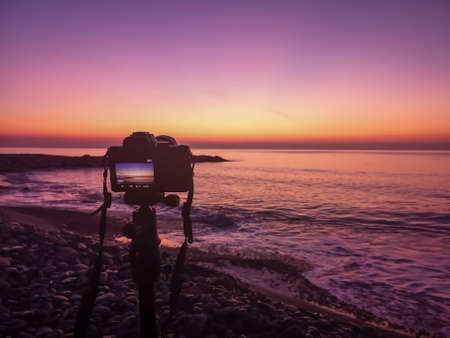 Sunrise view on Burriana beach with purple and orange tones