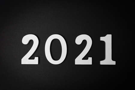 Conceptual image of the arrival of a 2021 represented in white on a black background. Hope concept