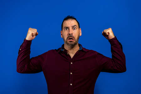 Closeup portrait happy successful student, business man winning, fists pumped celebrating success...