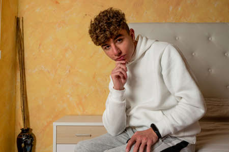 Stressed and Sad Handsome man sitting on the bed. Disappointment, Depression, Insomnia, Anxiety and...