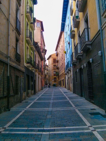 Vertical photo of a narrow and small street or alley in Navarre, Spainのeditorial素材