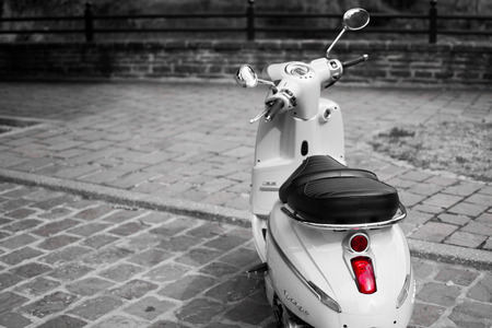 Black and white picture of a classic scooter or vespa (Peugeot Django) parked in the streetのeditorial素材