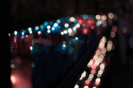 A lot of colorful candles glowing in Covadonga, Asturias, Spain. Religious symbol of the spanish...