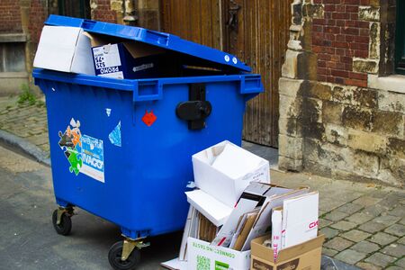 Industrial urban city street with trash and garbage dumpsters in Ghent, Belgium, Europeの写真素材