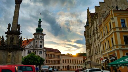 Loket, Czech Republic; 5/19/2019: Sunset in the cloudy skyline of the Loket Market (or main square...