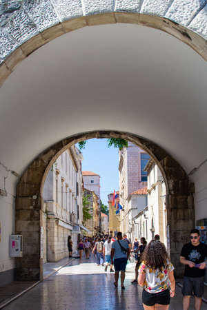 Zadar, Croatia; 07/17/2019: Vertical picture of the arch of Bridge Gate and Jurja Barakovica street in the old town of Zadar, Croatiaのeditorial素材