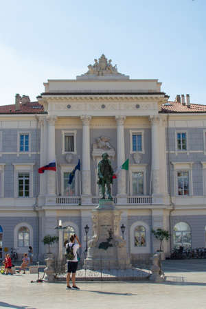 Vertical picture of the facade of Town Hall and Giuseppe Tartini Statue in Tartini Square, in the old town of Piran, in Sloveniaのeditorial素材