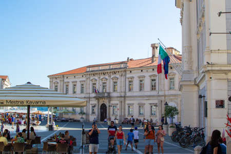 Piran, Slovenia; 7/19/19: Tartini Square with the Court Palace at the background and some bar terraces, in the old town of Piranのeditorial素材