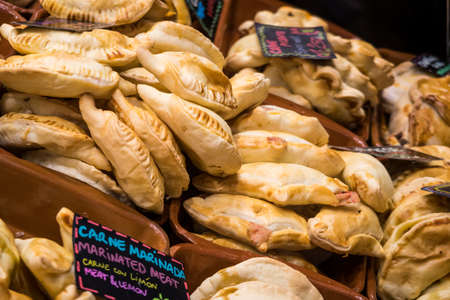 Freshly Baked Empenadas on sale at St Josep La Boqueria Street Market in Barcelona.  Catalan Region of Spainの写真素材
