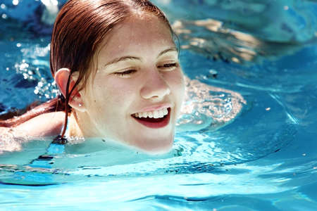 Girl in a poolの写真素材