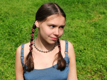 Teenage girl on grassの写真素材