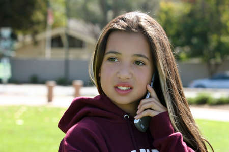 Teenage girl on the phoneの写真素材