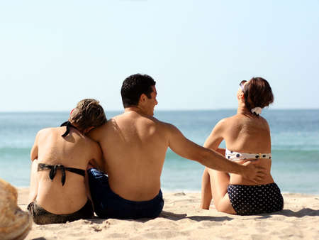 Love triangle on the beachの写真素材