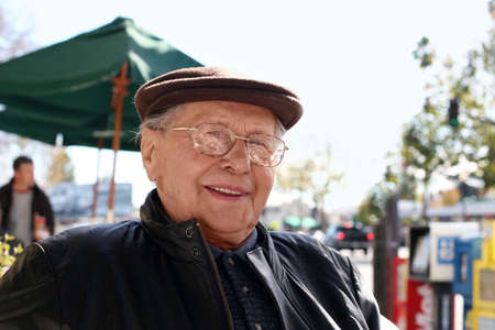 Senior man enjoying a sunny day in the city