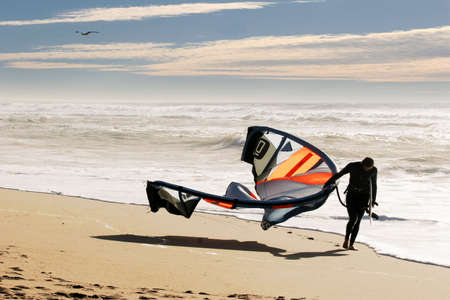 Kite surfer on the beach at Santa Cruz, Californiaの写真素材