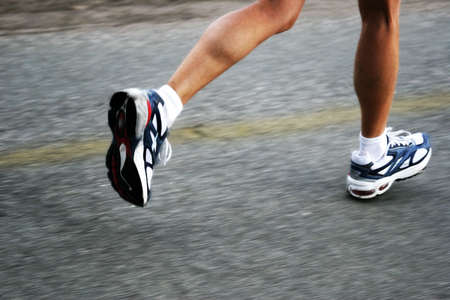 Feet of a running woman