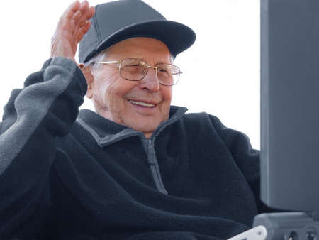 An old man enloying Internetの写真素材