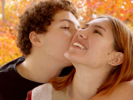 Autumn portrait of 2 teenagersの写真素材