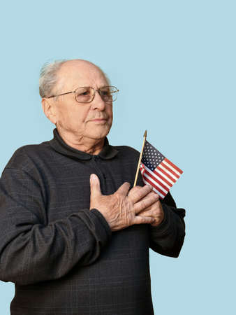 Senior man with american flag isolated