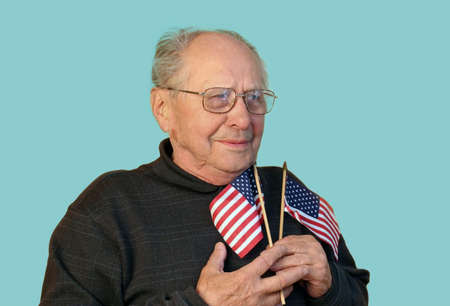 Senior man with american flag isolatedの写真素材