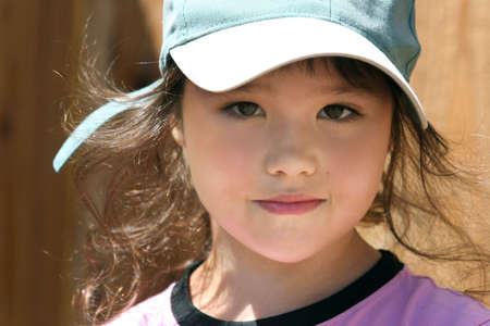 Happy little girl in a hatの写真素材