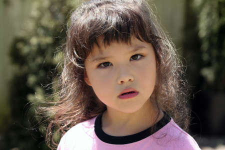 Cute little girl listeningの写真素材