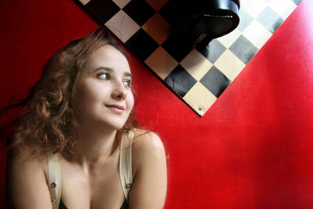 Happy smiling girl on redの写真素材