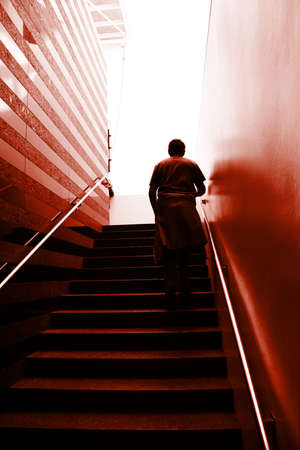 Man climbing on the stairsの写真素材