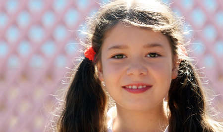 Cute eight year old girl on a sunny day