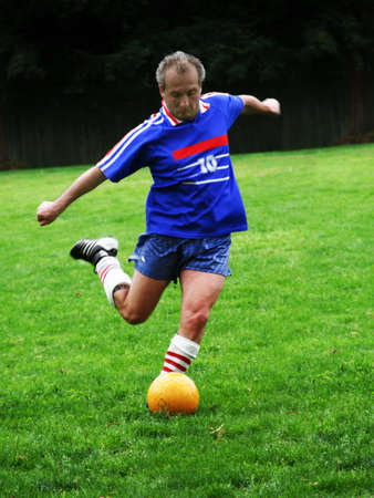 Soccer player hitting a ballの写真素材