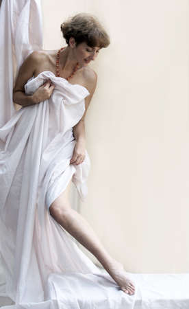 Beautiful mature woman dressing upの写真素材