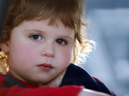 A close-up of a cute sad baby boyの写真素材