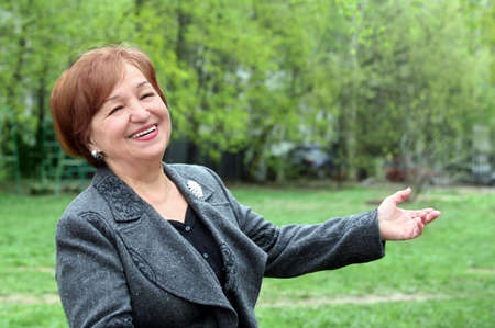 Portrait of a laughing woman in her seventiesの写真素材