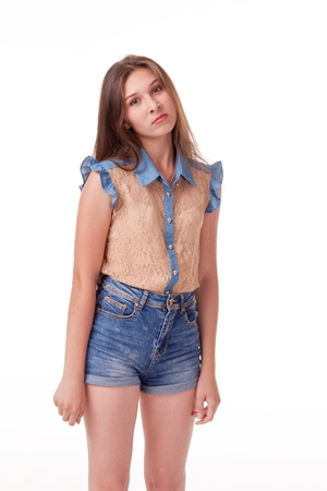 Beautiful girl dancing in the camera, posing against white background. Different poses and emotions. Standing, moving, smiling. playful dances, choreography. Brunette with long hair, slender, cheerful and charismaticの写真素材