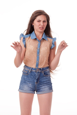 Beautiful girl dancing in the camera, posing against white background. Different poses and emotions. Standing, moving, smiling. playful dances, choreography. Brunette with long hair, slender, cheerful and charismaticの写真素材