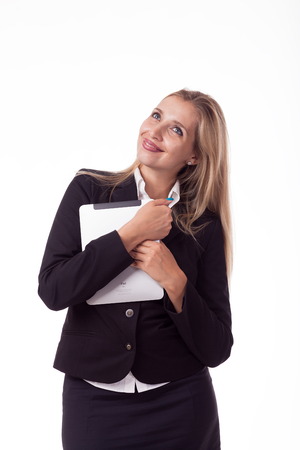 Blonde with long hair posing with white plate, pattern. For logo, advertising. Isolated photo on a white background for advertising. In a business black suit.の写真素材